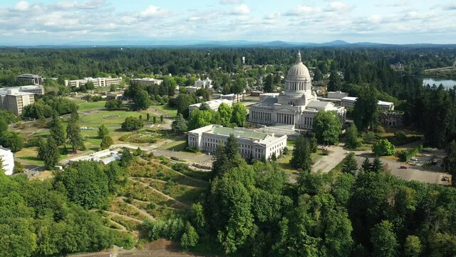 Cinematic 4K aerial drone 360 footage of the Washington State Capitol Building and Campus, Capitol Lake, with a panoramic view of Historic District in Olympia, Washington