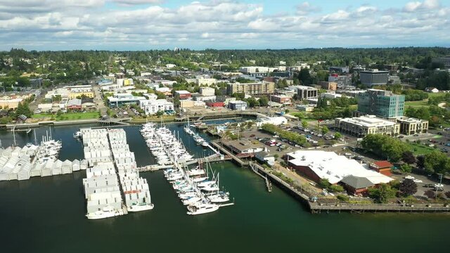 Cinematic 4K aerial drone trucking shot of the Olympia Yacht Club near the Washington State Capitol Building, campus, Capitol Lake, with a panoramic view of Historic District in Olympia, Washington