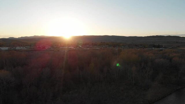 Sunset over river and small town 
