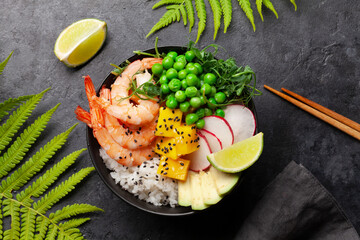 Poke bowl with shrimps, avocado and mango