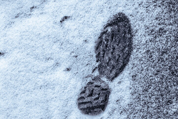 Close up footprint in snow. Background image for snow conditions.