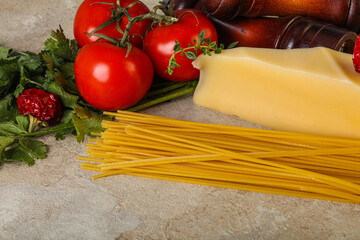 Raw Italian spaghetti heap with cheese