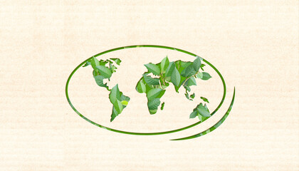 Ecology and zero waste concept. World map silhouette and green leaves on cardboard texture