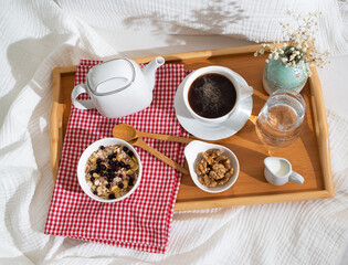breakfast in bed in an early sunny morning
