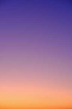 Abstract yellow orange purple gradient color of sky sunset . High vertical quality photo