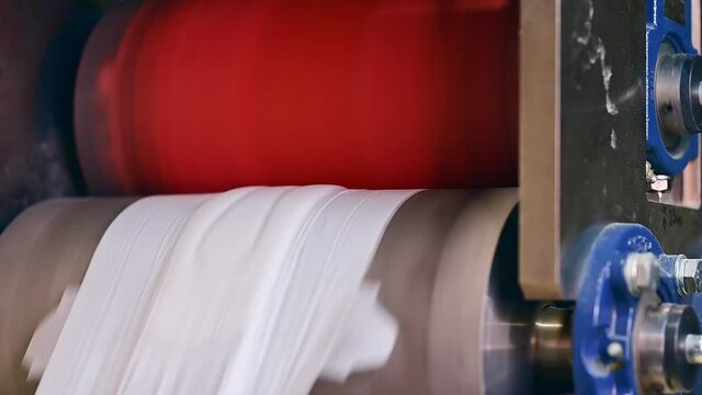 Diapers conveyor factory making. Automated mechanism for making pampers.