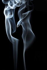 abstract white smoke swirls on black background