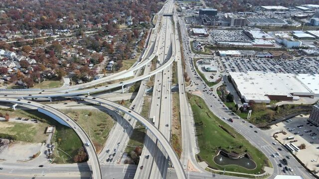 Drone shot going backwards at the crossroad intersection between I-64 and I-170 in St. Louis, MO