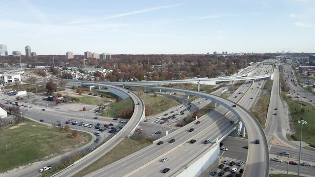Cars driving by at the crossroad intersection between I-64 and I-170 in St. Louis, MO