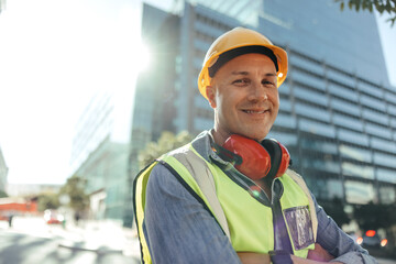 Happy construction worker smiling at the camera in the city - Powered by Adobe