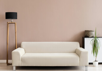 Living room interior wall mockup in warm tones with beige minimal sofa and lamp. Interior mockup with empty wall template