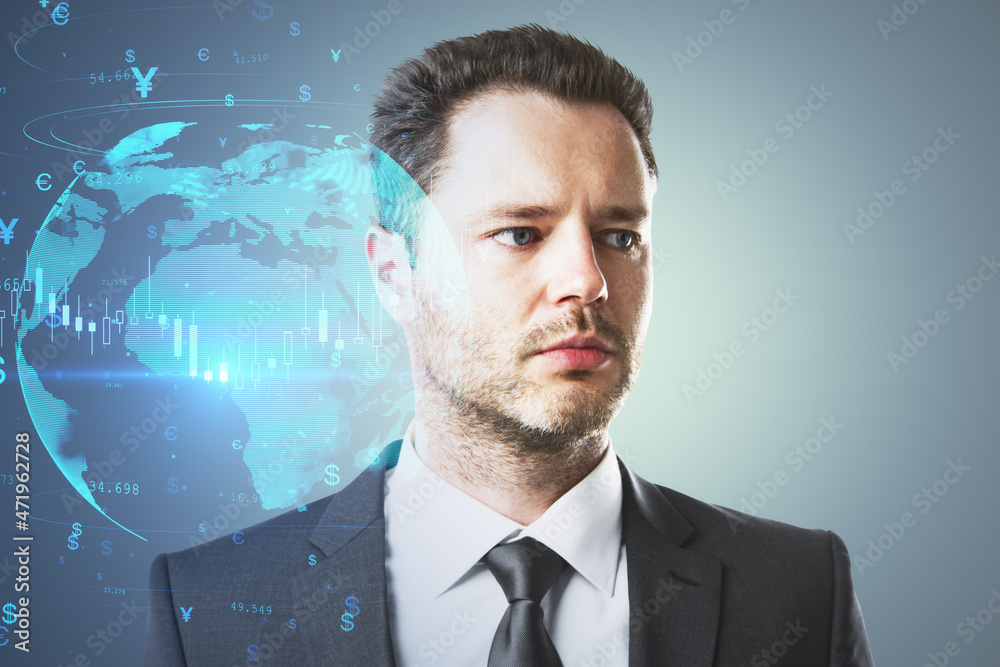 Poster attractive young european businessman thinking about globe with candlestick chart on gray background
