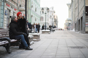 Young couple walking through the winter