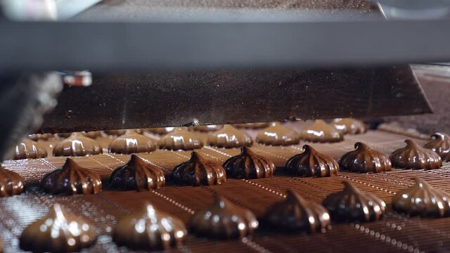 Delicious sweet deserts conveyor technology. Factory making chocolate candies.