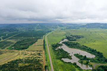 Scenic aerial view flying over the land field.