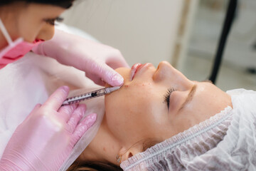 Cosmetic procedure for biorevitalization and removal of wrinkles for a young beautiful girl....