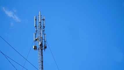 Technology on the top of the telecommunication GSM 5G, 4G, 3G tower.Cellular phone antennas on a building roof.silhouette of Telecommunication mast television antennas.