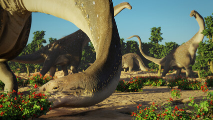 Alamosaurus eating berries, group of dinosaurs from the Late Cretaceous period at sunrise © dottedyeti