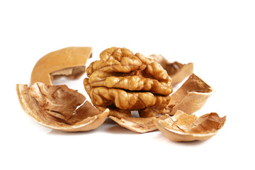 Macro of peeled walnut. Whole walnut kernel  and cracked walnut shell isolated  on white background. 