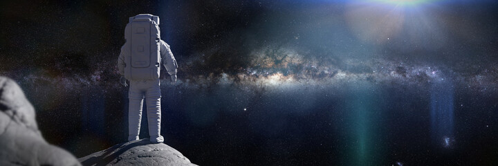 Fototapeta na wymiar astronaut on the Moon, spaceman watching the Milky Way galaxy