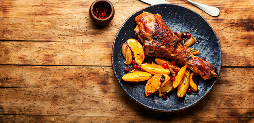 Turkey leg with orange, fried meat