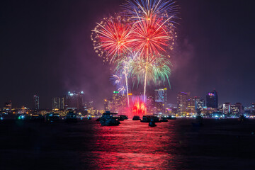 fantastic and colorful fireworks display over the night sky of the city during a festival