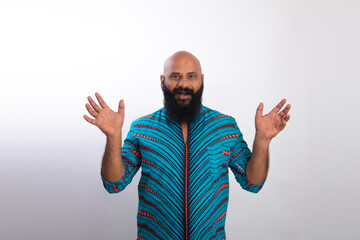 Surprised Indian healthy bald beard man. People lifestyle concept. Keeping mouth open spreading hands