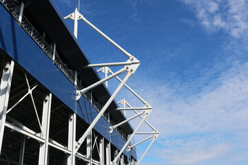 Stadium steel structure with blue sky background.	