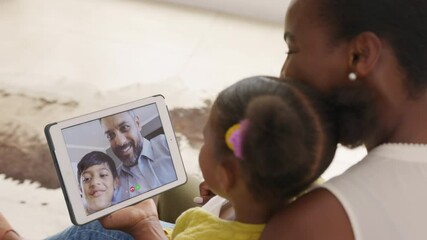 Multiethnic family doing video call using digital tablet