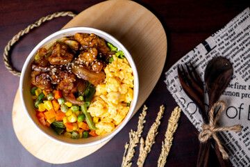 Indonesia style rice bowl, contain chicken katsu, egg, and vegetables