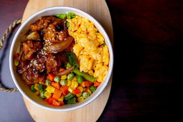 Indonesia style rice bowl, contain chicken katsu, egg, and vegetables