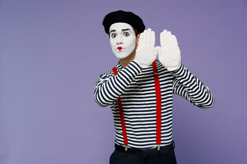 Fun blithesome charismatic vivid young mime man with white face mask wears striped shirt beret...