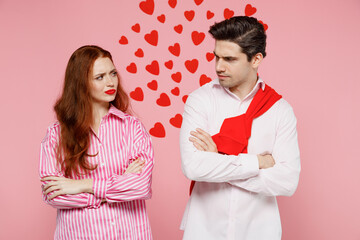 Young offended sad couple two friends woman man 20s in casual shirt hold hands crossed folded...