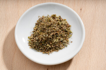 Detailed and large close up shot of oregano on a small plate