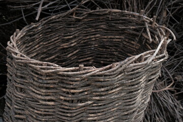 Wicker basket. old wicker basket eaten by tree worms. tree wormwood background