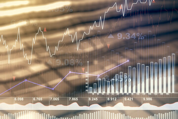 Abstract virtual financial graph hologram on blurry abstract metal background, forex and investment...
