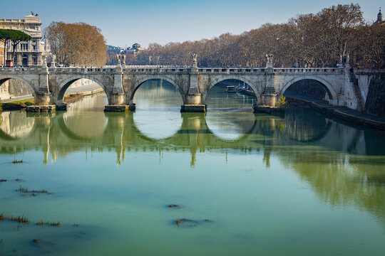 A view of Ponte Sant'Angelo (Bridge of Hadrian) on Tiber river in front of Castel Sant'Angelo (Castle of the Holy Angel)  in Parco Adriano, Rome, Italy