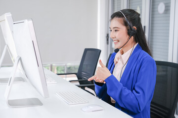 beautiful asian woman working call center operator with headset in office or workplace