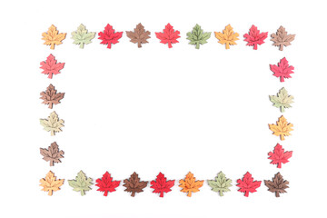 A rectangle made up out of decorative wooden leaves
