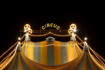 A circus tent at night with its colorful lights on  © RMMPPhotography