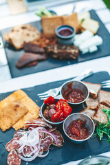 Variety of snacks on a stone board