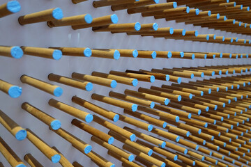 A lot of wooden blue pins to a wall.  texture background       