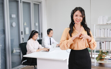 beautiful asia woman working call center operator with headset in office or workplace