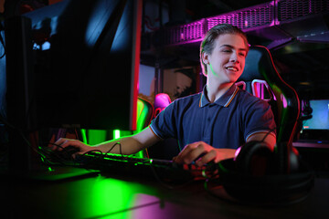 Cyber sport. Team play. Professional cybersport player training or playing online game on his PC