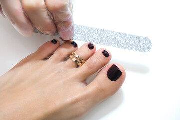 medical pedicure with a nail file. Foot peeling procedure