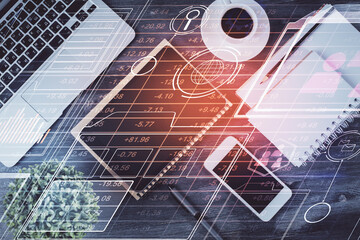 Double exposure of technology theme drawing over work table desktop. Top view. Global data analysis concept.