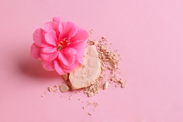 Face powder. Broken pieces of cosmetic powder. Cosmetic smear.