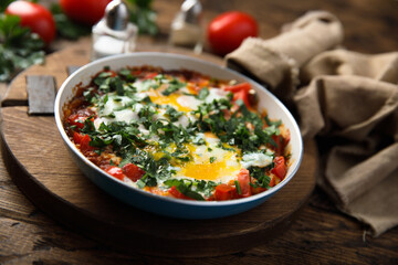 Traditional homemade shakshuka with fresh parsley