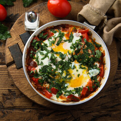 Traditional homemade shakshuka with fresh parsley