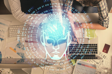 Double exposure of man and woman working together and human brain hologram drawing. Brainstorm concept. Computer background. Top View.